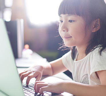 young girl doing activities on a computer